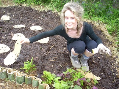 A cardboard stepping stone in Lasange garden with Cecilia